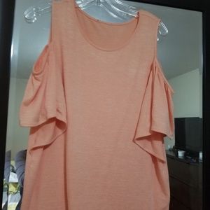 Peach color, cold shoulder shirt.